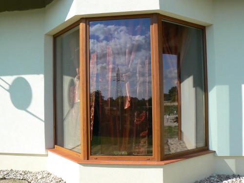 Okno PVC w wykuszu , system CT70 , kolor Złoty dąb